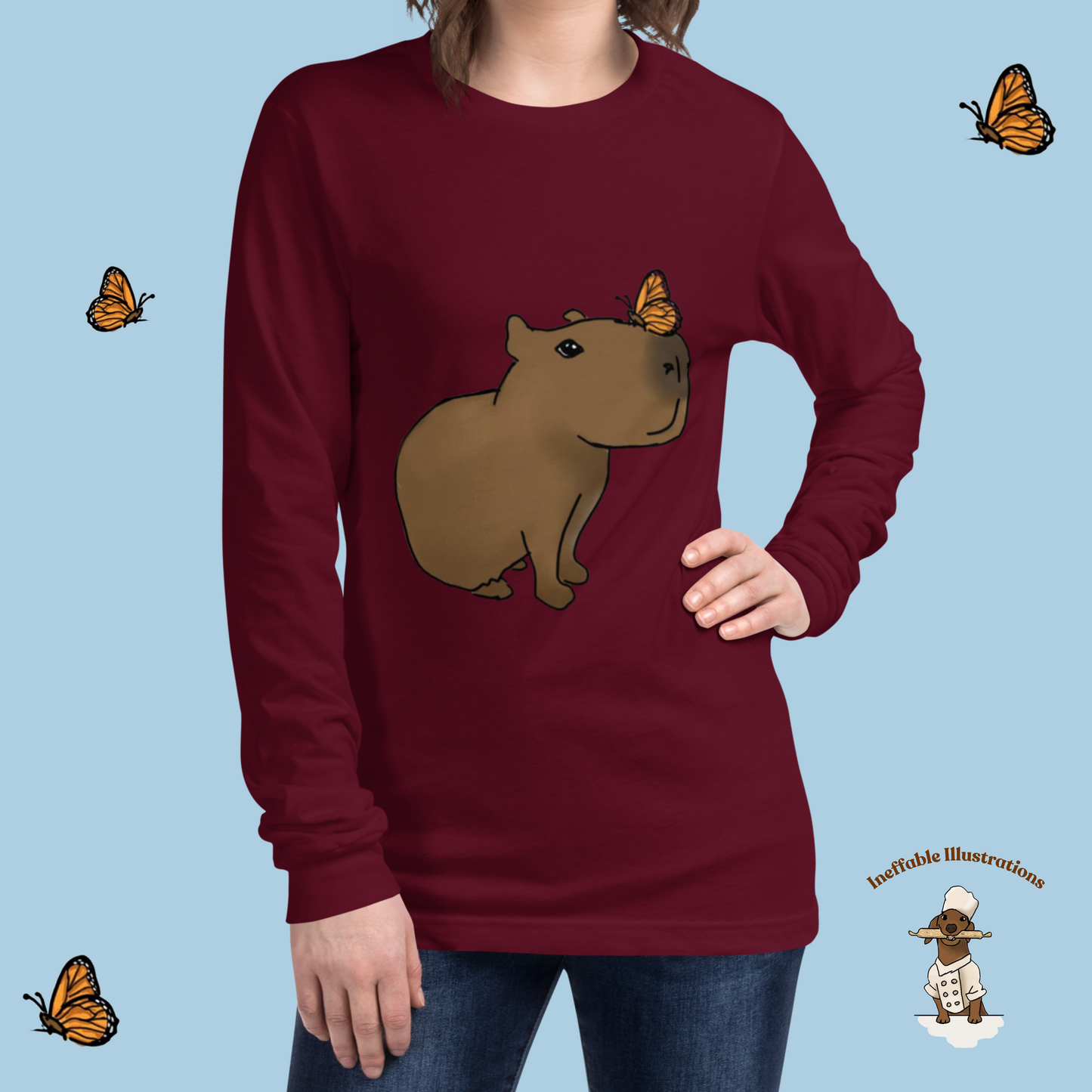 Shirt. Unisex Long Sleeve Shirt with cute Capybara Jolly with butterfly illustration, drawn by hand. Capybara shirt